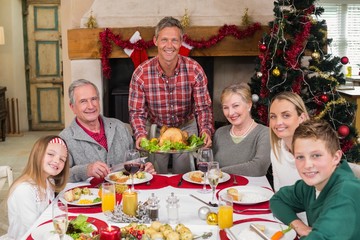 Man serving roast turkey at christmas