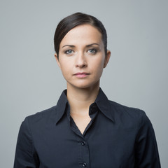 Serious woman in blue shirt