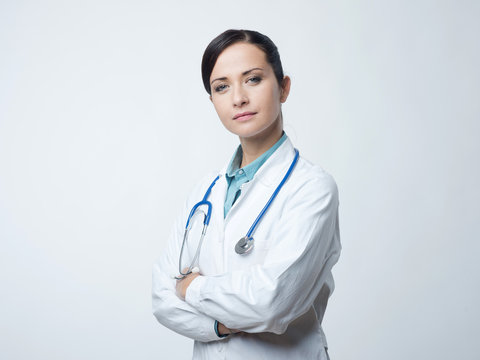 Confident female doctor with lab coat