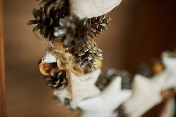 Christmas wreath with pine cones, stars