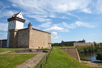 Fototapeta na wymiar Two fortresses on parties from river which is border. Narva,