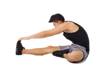 Fototapeta na wymiar fitness man sitting and making stretching exercises