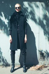 Ms. Leon Killer concept. Young beautiful girl in trendy black co