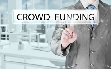 Businessman pushes virtual crowd funding button