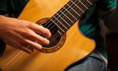 Fototapeta premium Man playing a guitar