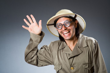 Funny safari hunter against background