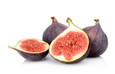 Four sliced figs isolated on white background
