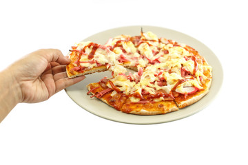 Hand holding piece of pizza isolated on white background