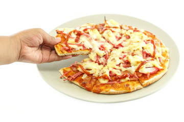 Hand holding piece of pizza isolated on white background