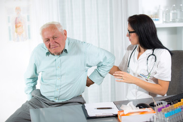 Doctor with male senior patient at office