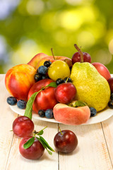 different fruits on the table on a blurred background