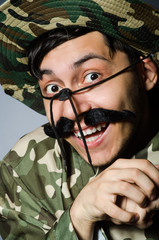 Funny soldier in military concept