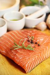 Beautiful filet of salmon on the wooden background