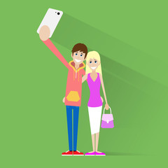 couple taking selfie photo on smart phone over green