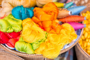 colorful silk thread and silkworm cocoons