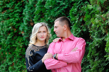 Obraz premium loving woman and a man walk in the green park