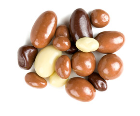 chocolate covered nuts and raisins isolated on white