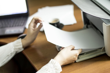 The process of inserting paper in laser printer cartridge