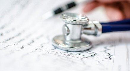Doctor analyzing electrocardiogram