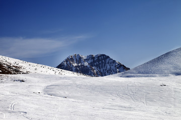 Fototapeta na wymiar Ski slope at sunny day