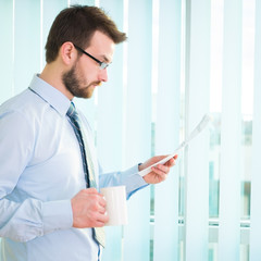 Fototapeta premium Young businessman in office.