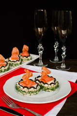 Sandwich with cream cheese and salmon on the holiday table