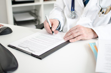 Fototapeta premium Doctor taking notes