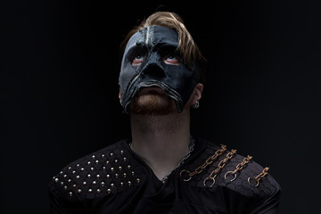 Photo of the blond man looking up in mask