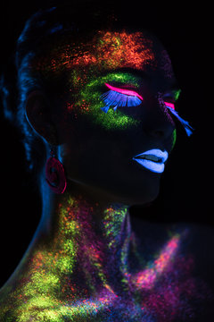 Sensual woman in fluorescent paint makeup