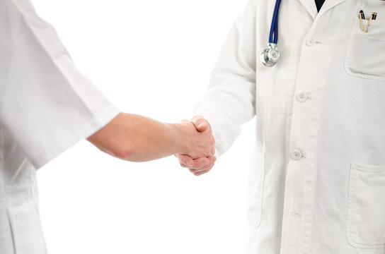 Doctor and nurse shaking hands
