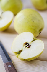yellow wet fresh apples in a wicker basket