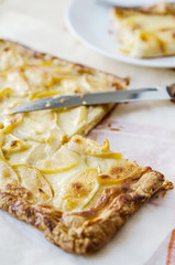 hot fresh flaky apple pie on a wooden table