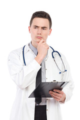 Thinking young male doctor with a clipboard