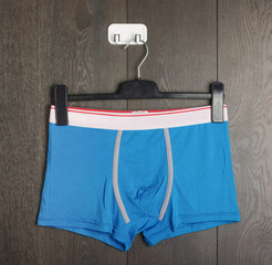 Sexy blue male underwear on the hanger