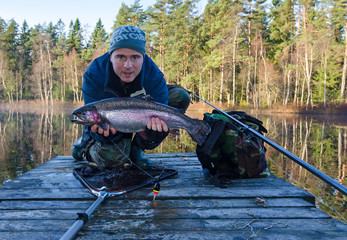 Happy angler with big November trout