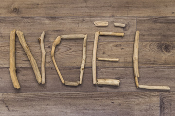 Noel spelt with driftwood