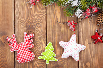 Christmas wooden background with snow fir tree and decor