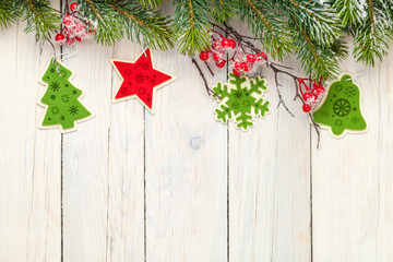 Fototapeta na wymiar Christmas wooden background with fir tree and decor