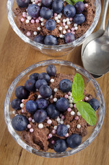 chocolate pudding with blueberries and mint