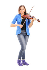 Young female artist playing a violin