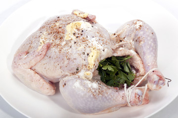 Uncooked Chicken Stuffed with Herbs Ready for Roasting