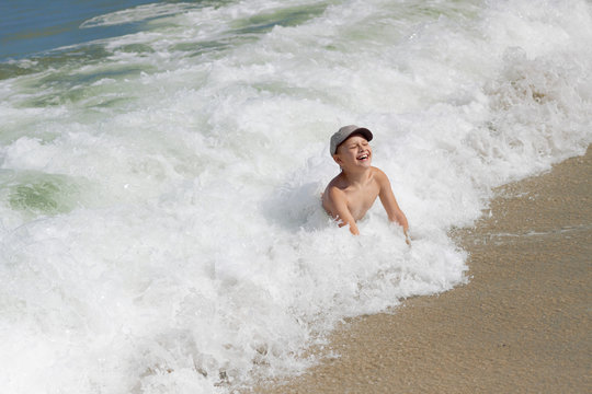 child boy sea wave splash summer vacation holidays