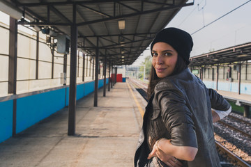 Pretty girl posing in a metro station