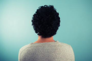 Rear view of man with curly hair
