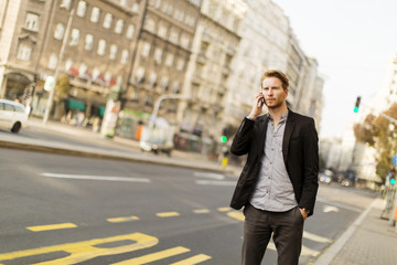 Young man on the street with mobile phone