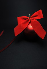 Christmas background with red ornament and ribbon