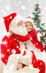 Fototapeta na wymiar smiling girl with santa claus and gift at home