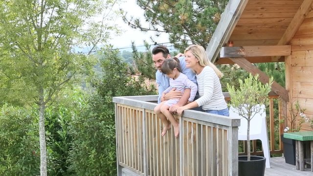 Family enjoying vacation in log cabin