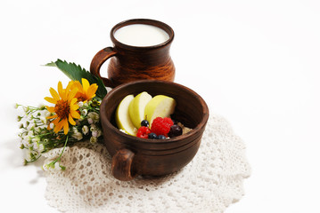 Obraz na płótnie Canvas Milk and curd with summer fruits in ceramic bowls