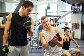 Fototapeta na wymiar men exercising on gym machine